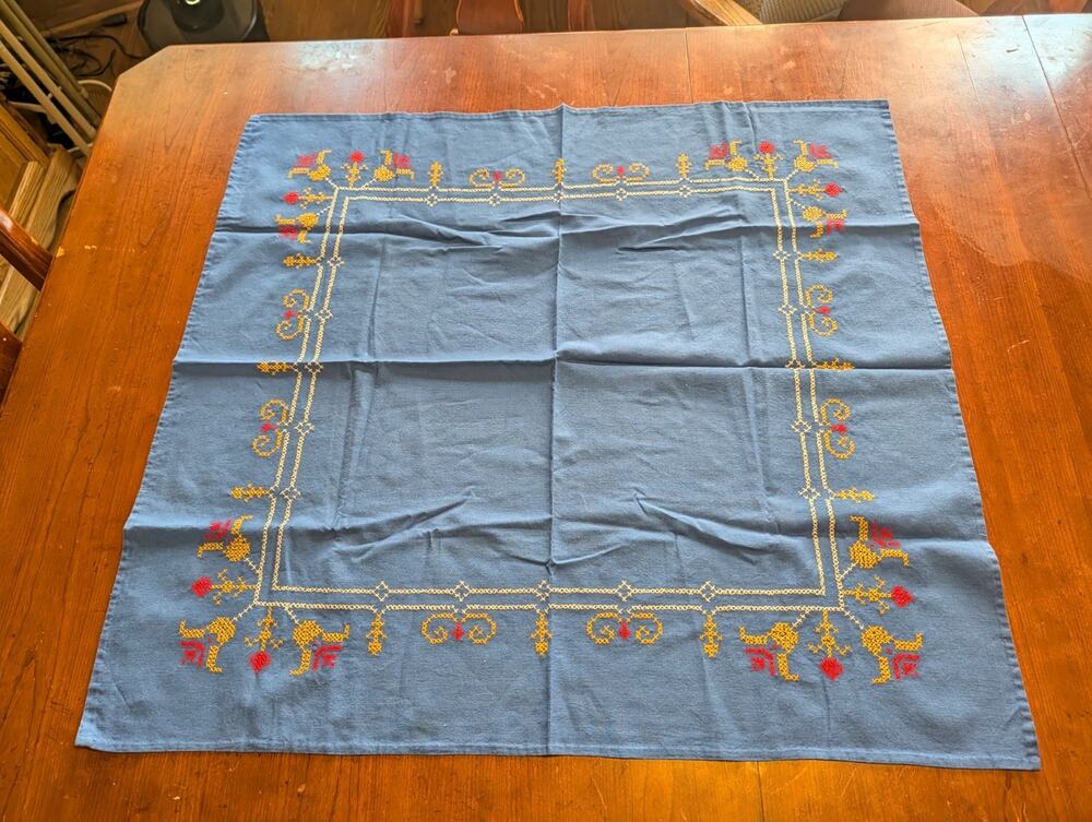 vintage hand-embroidered cotton-linen tablecloth features a charming floral Blue